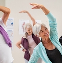 Senior people stretching at gym