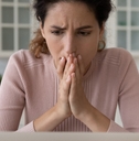Shocked hispanic female read unexpected bad news on pc