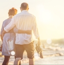 elderly couple hugging on seacoast