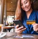 Woman buying something with credit card