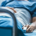 in the hospital sick male patient sleeps on the bed