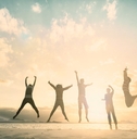 group of people jumping for good life on weekend