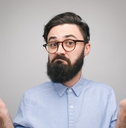Confused man holding hands apart