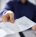 businessperson hands giving cheque