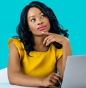 Woman working on computer and thinking
