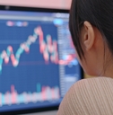 adult woman reviewing stock market performance
