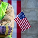 Worker holding American flag