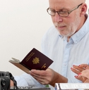 Senior couple preparing vacation trip with passport