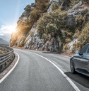 car driving on a mountain road