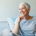 mature woman relaxing on her couch at home in the sitting room