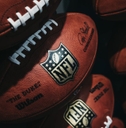 Rows of NFL footballs