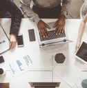 team of young office workers graph