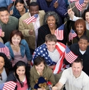 High angle view of people raising American flags