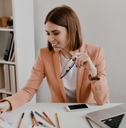 lady with smile looks at documents 