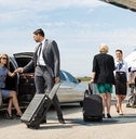business partners about to board private jet