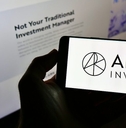 Ark Invest on the phone screen and background computer screen