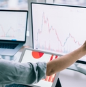 professional woman working with graphs on computer