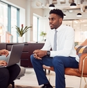 businesswoman interviewing male job candidate