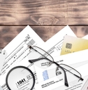 Estate tax forms and papers scattered on a desk 