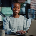 adult woman using a laptop on a desk