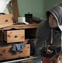 burglar stealing Items from bedroom
