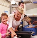family at airport passing through security check