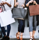 several people holding shopping bags
