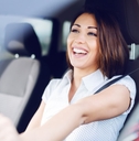 happy woman driving her car