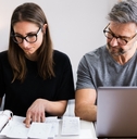 couple doing taxes and family budget
