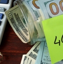jar with label 401k and money on the table