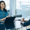 female employee talking with male colleague
