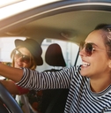  young women driving in a car