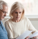 old couple reading documents