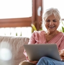 happy senior couple using laptop 