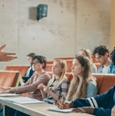 professor holding lecture to a multi ethnic group of students