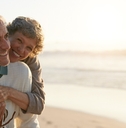 senior couple having fun at the beach
