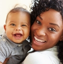 Mother holding happy baby