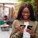 Woman using credit card on her phone