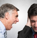 angry businessman shouting to an employee
