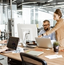 different employees working and interacting in workspace 