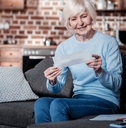 joyful pensioner keeping smile