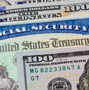 Social Security card treasury check and 100 dollar bills