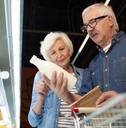 senior couple choosing milk