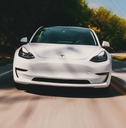 White tesla fast on the road