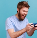 Man playing a mobile gaming app