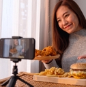 Woman filing  herself with food