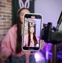 TikTok creator talking in front of a camera phone