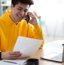 A young virtual assistant on the phone with their client
