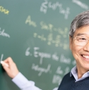 happy senior asian professor teaching calculus in classroom