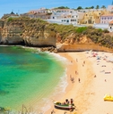 beautiful houses in line at strand algarve beach in portugal